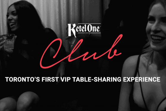 Black and white photo with two girls drinking and laughing. Text on top of the image says "Ketel One Club. Toronto's first vip table-sharing experience".