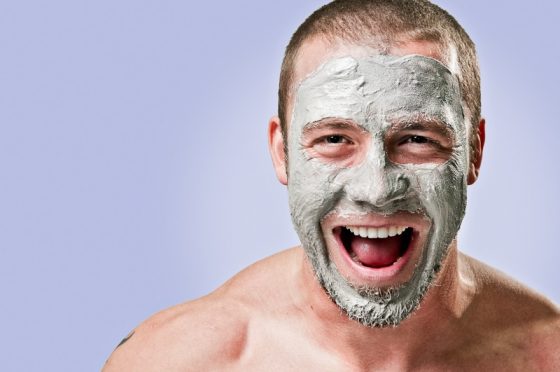 Man smiling big with face mask on
