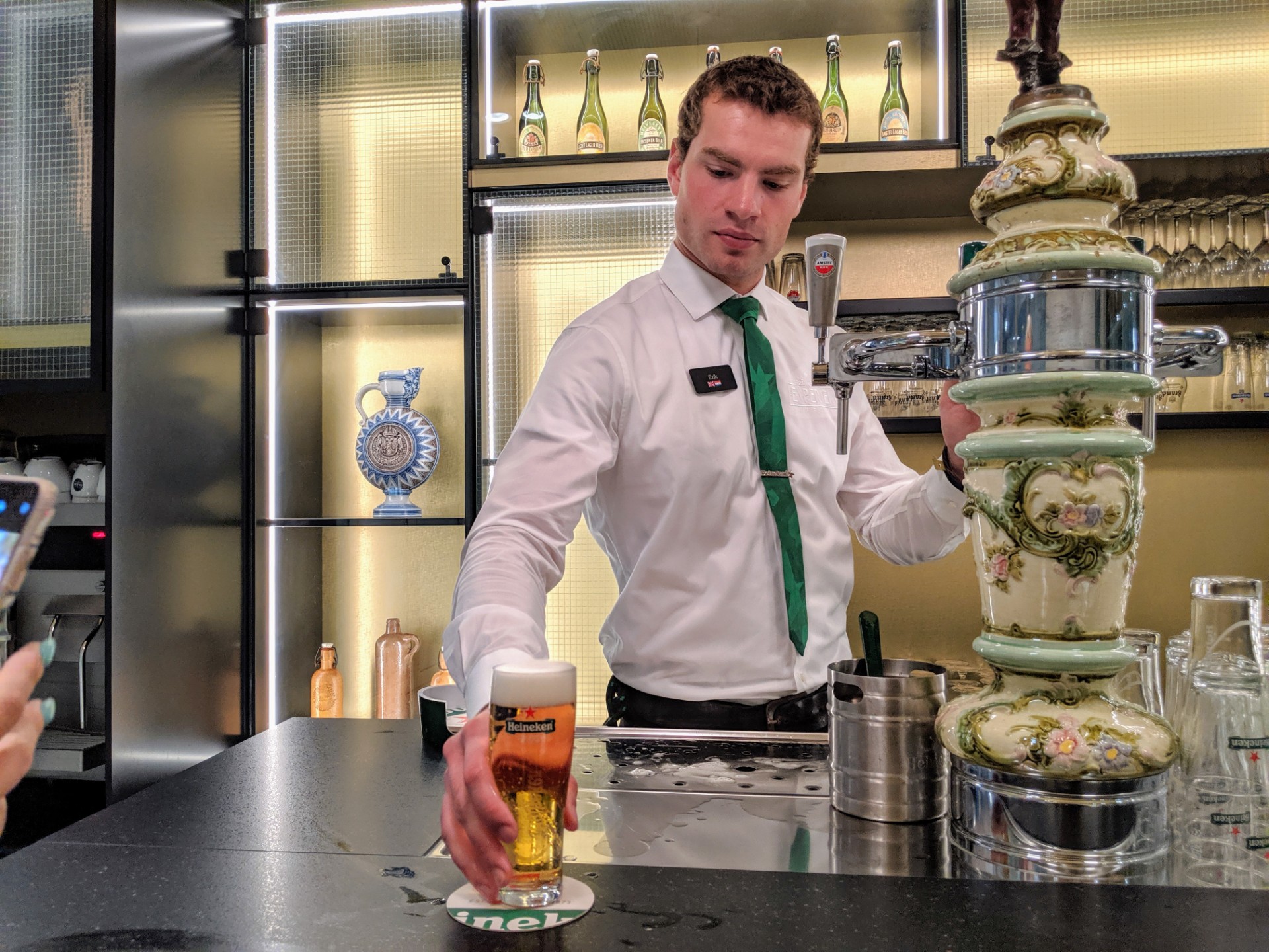 Bartender Pouring the Perfect Heineken