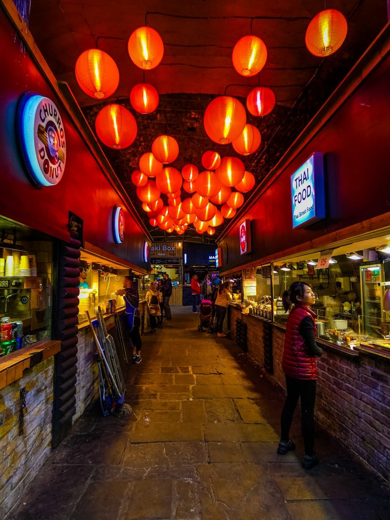 bars at night with lights and people