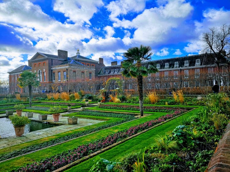 hyde park in london with a building and trees