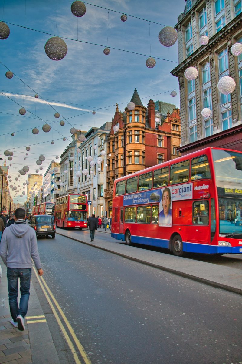 oxford street with people walking and a double decker bus