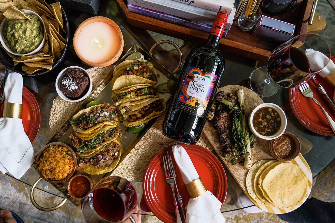 Gato Negro wine from LCBO pride special edition bottle, enjoying El Catrin tacos takeout for dinner with friends. View the VIBE. VSPT