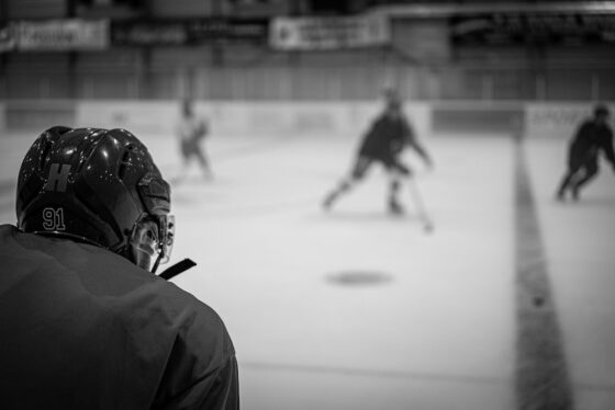 hockey players on ice playing shinny