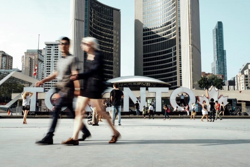 people walking in front of city hall in Toronto