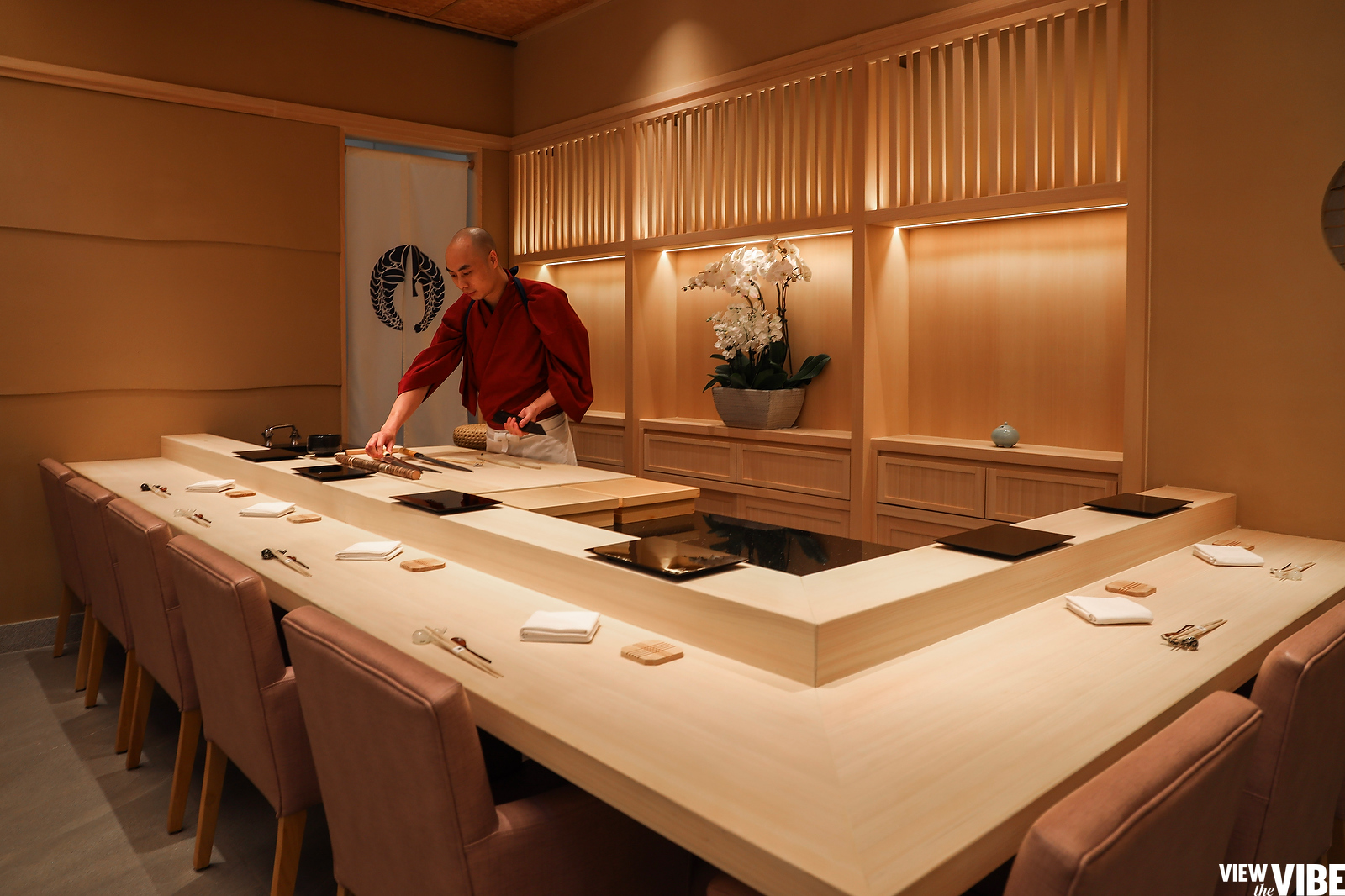 Chef preparing counter for dinner service Katsuo Ishibashi