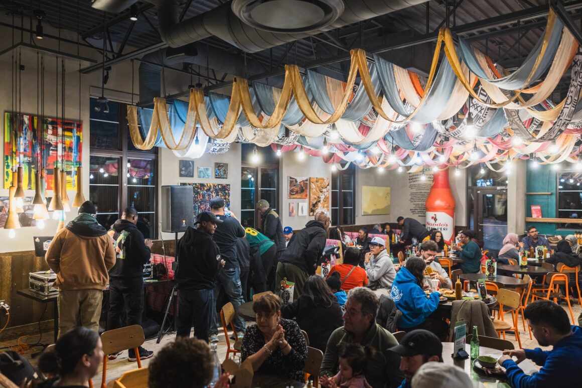 People in attendance at the Jamaica Relief event at Nando's with Kardinal Offishall