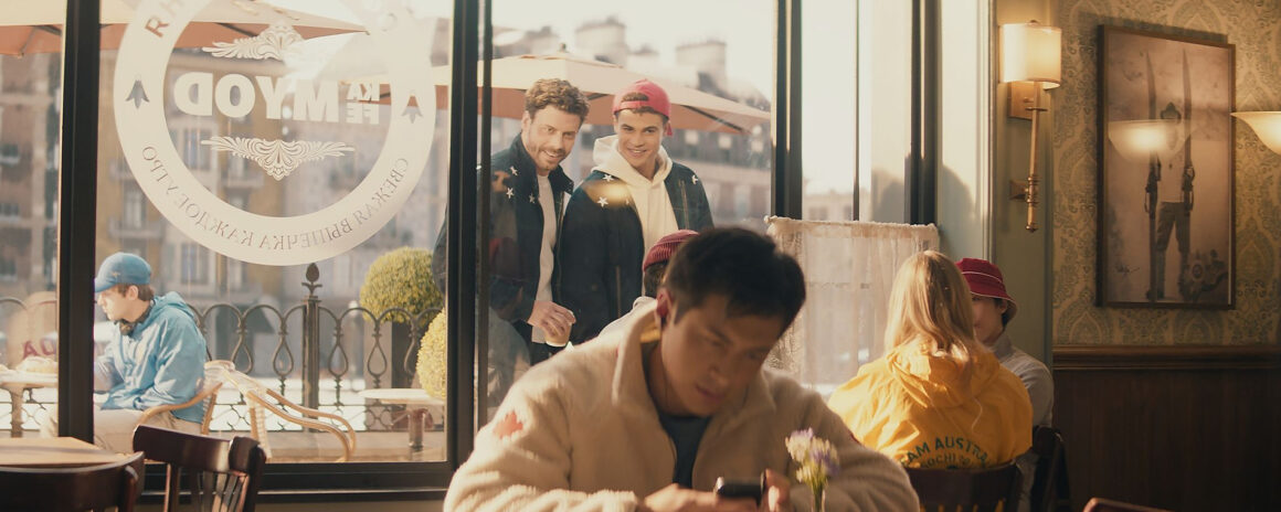 Heated Rivalry Olympics scene in Russia where Shane Hollander wears a Canadian sweater that went viral, inspiring fans to recreate the look. (Photo: Courtesy of Crave / Bell Media)