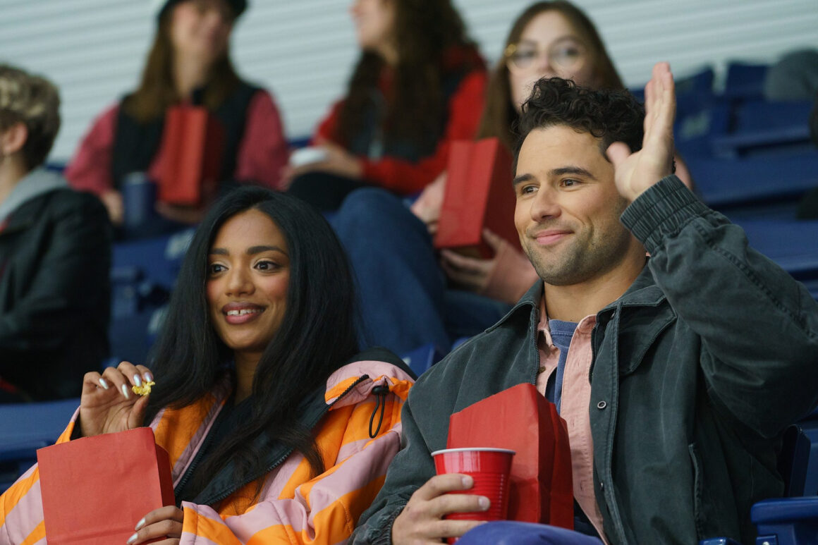 Kip and his girlfriend at a game where they are sitting in Scott Hunter's seats and he waves at him. (Photo: Courtesy of Crave / Bell Media)