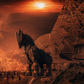 Troy ancient city greek mythology Turkiye Canakkale Turkey tourism The Odyssey movie Christopher Nolan G Adventures. Split hero image showing the Trojan Horse from the 2004 film Troy on the Çanakkale waterfront beside an aerial view of the ancient Assos theatre and Temple of Athena overlooking Türkiye’s Aegean coastline.