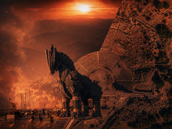 Troy ancient city greek mythology Turkiye Canakkale Turkey tourism The Odyssey movie Christopher Nolan G Adventures. Split hero image showing the Trojan Horse from the 2004 film Troy on the Çanakkale waterfront beside an aerial view of the ancient Assos theatre and Temple of Athena overlooking Türkiye’s Aegean coastline.