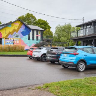 Chevrolet Equinox EV and Bolt EV on a road trip to Prince Edward County parked outside The Drake